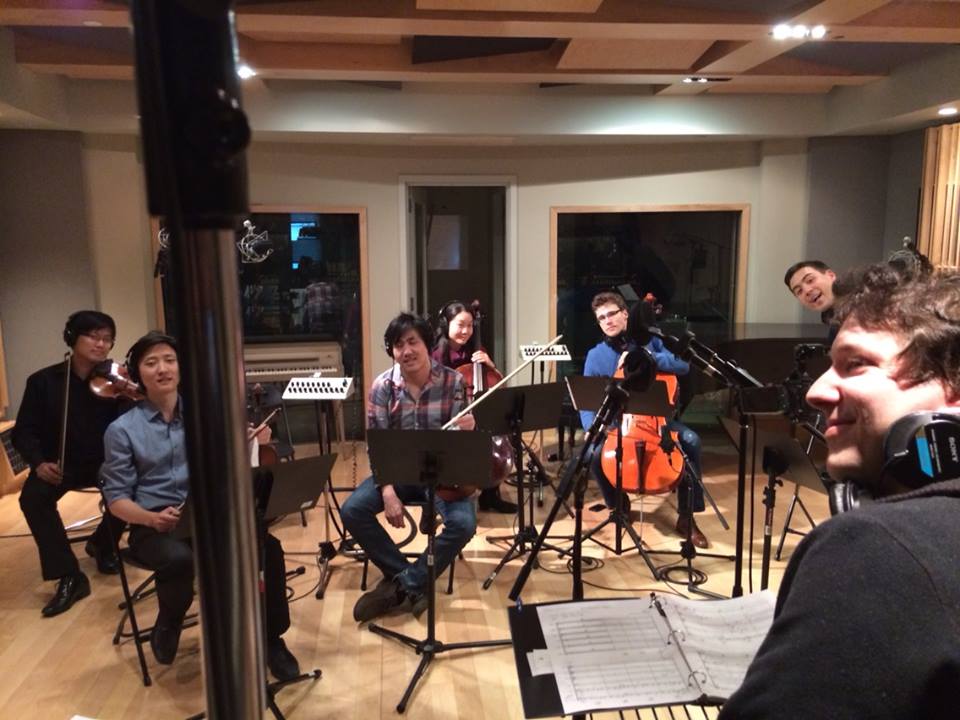 Members of the Metropolis Ensemble recording string arrangements